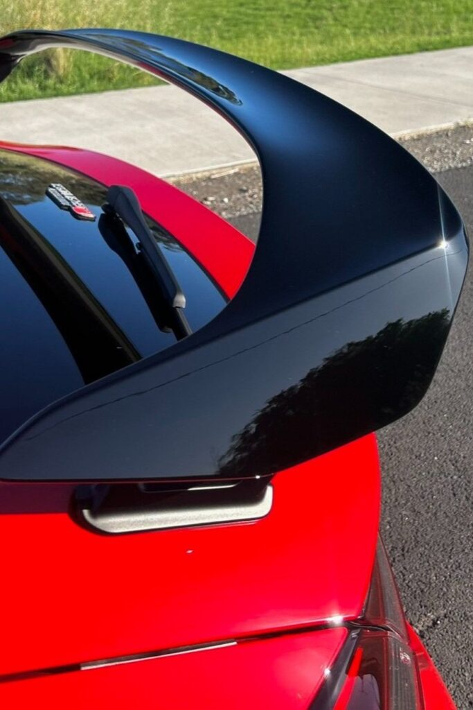 Paint correction on red sports car